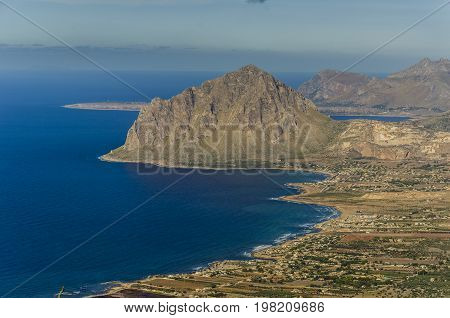 Aerial view of the Sicilian coast and on the horizon you can see the silhouette of the island of Ustica