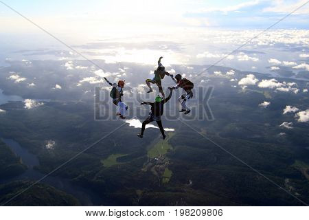Skydiving over beautiful Norway. Clouds, sun and sky