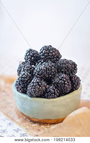 Homemade, sweet, delicious blackberries in a handmade dish