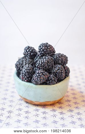 Homemade, sweet, delicious blackberries in a handmade dish