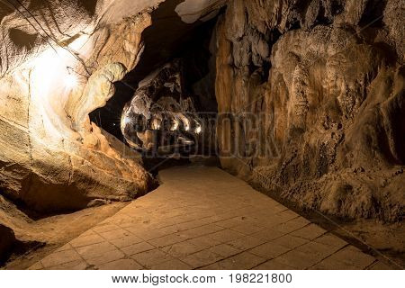 Wide angle picture of Stalactite and stalagmite inside Tham Chang Cave in the city of Vang Vieng Laos.