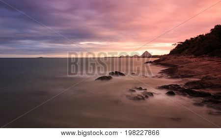 Stunning Sunset On The Beach. Beautiful Colors And Dramatic Clouds At The Sky.