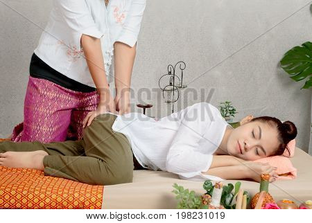 Traditional Thai Massage, Woman Getting Thai Deep Massage In Spa