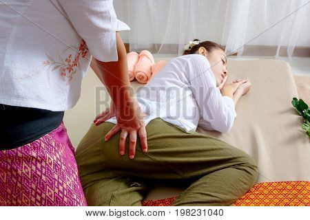 Traditional Thai Massage, Woman Getting Thai Deep Massage In Spa
