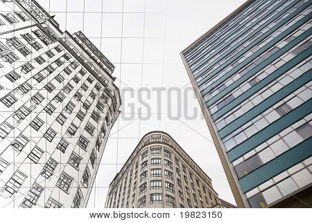 Architectural gradient, blueprint fading into building.
