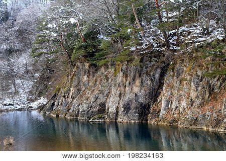 walking along the river and rocks in Shirakawa-go