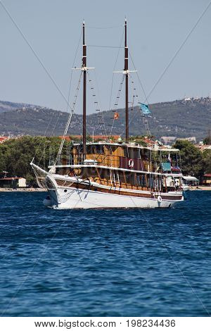 wooden cruise ship with two masts on the sea