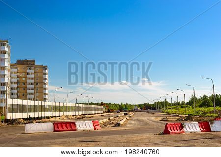 Construction of high-speed bypass road around Krasnoe Selo, Saint Petersburg. Heavy machine equipment for excavation works at civil industrial construction. Russia
