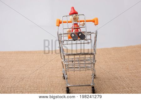 Pinocchio Sitting On Shopping Trolley