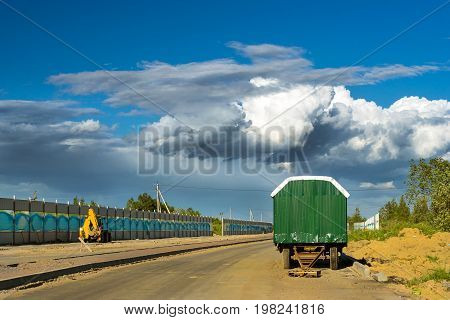 Working shed trailer for workers. Construction of high-speed bypass road around Krasnoe Selo Saint Petersburg. Heavy machine equipment for excavation works at civil industrial construction. Russia