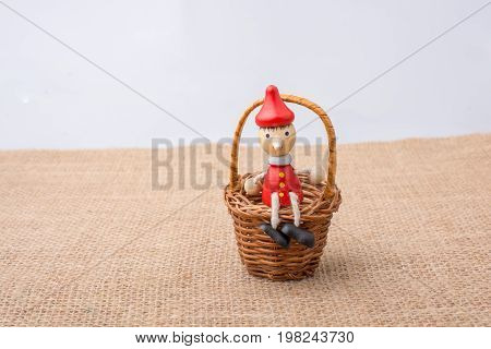 Wooden Pinocchio Doll Sittingmini Basket