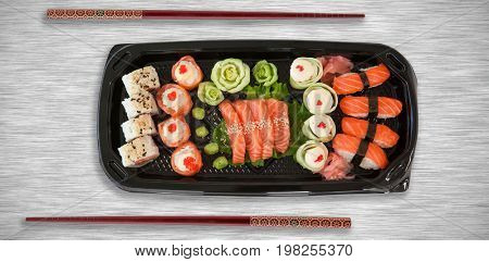 High angle view of fresh food in tray against grey texture background