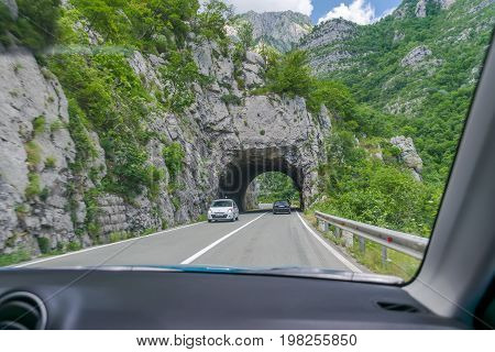 A Picturesque Journey Along The Roads Of Montenegro Among Rocks And Tunnels. The River Moraca.