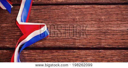 Red white and blue ribbons on wooden table