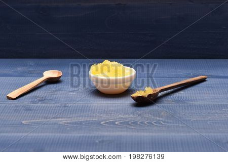 Wooden Spoons Next To Porringer With Honey, Close Up