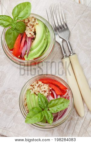 Warm Quinoa Salad With Vegetables - Avocado, Red Onion, Tomatoes, Bell Pepper, Basil And Olive Oil.