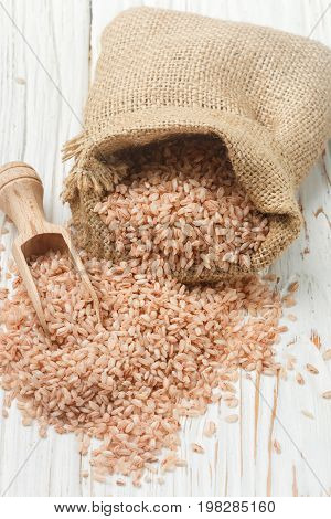 Raw Organic Devzira Rice On A White Table