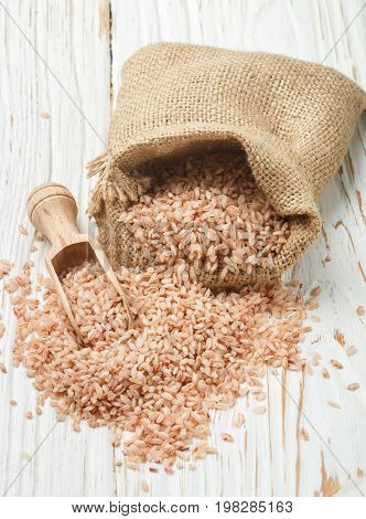 Raw Organic Devzira Rice On A White Table