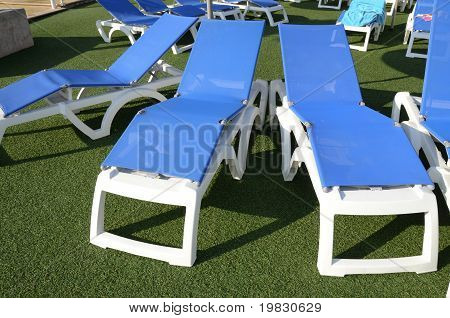 chairs at poolside