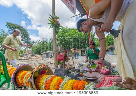 HOWRAH WEST BANGALINDIA - JULY 7TH 2017 : khutipuja the starting ritual of world famous Durga Puja (most famous festival of Hinduism) is being performed by a Hindu Priest amongst Hindu devotees.