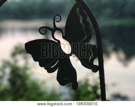 Metal Butterfly showing off the beautiful pond