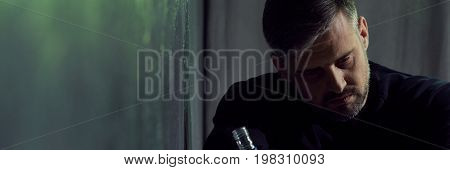 Man In Despair Holding Bottle