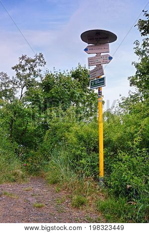 Lovosice, Czech Republic - July 05, 2017: Tourist Signpost On Green Tourist Path  Leading To Lovos H