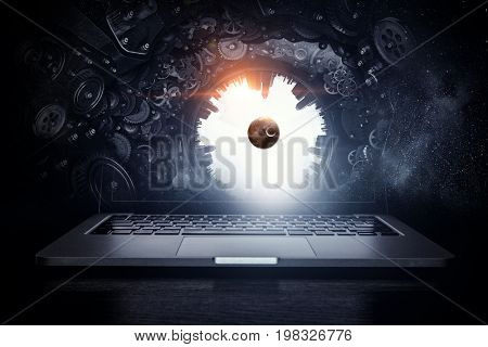 Laptop and construction concept. Mixed media