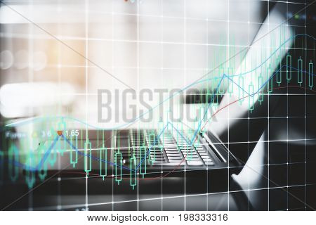Side view and close up of laptop with forex chart on blurry background. Trade concept. Double exposure