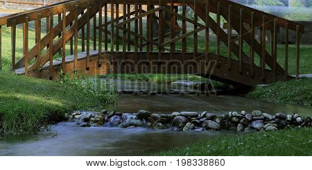 A lazy mountain stream meandering through a park