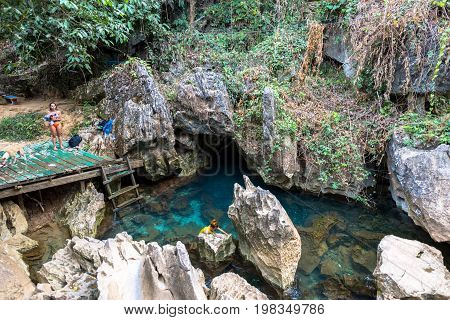 VANG VIENG LAOS - MARCH 14 2017: Horizontal picture of Blue Lagoon at Tham Chang Cave close to the city of Vang Vieng Laos.