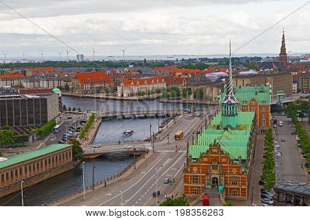 Waterfront city buildings along the canal in Copenhagen Denmark. Copenhagen city panorama in summer Denmark.