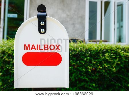 Close up of the mail box (or post box) is a box outside a person's house where letters are put.
