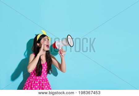 Young Smiling Woman Holding Loudspeaker Device