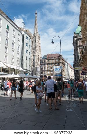 Vienna Austria - July 31 2017: Stephansplatz in Central Vienna with famous St. Stephens Cathedral. Tourists are walking around and enjoy the points of interest on a sunny day