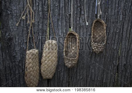 The old bast shoes hang on the fence and dryed