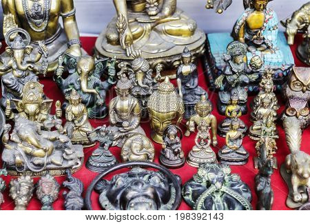 hindu god idols displayed outside of a shop