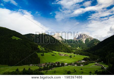 Dolomite landscapes in the summer green of Trentino