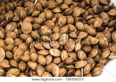 Apricot kernels on white ground, pictures of apricot kernels used in medicine and pill making,