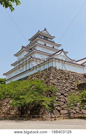 AIZUWAKAMATSU JAPAN - MAY 30 2017: Reconstructed Main Keep of Aizu-Wakamatsu Castle (Tsuruga-jo) Japan. Castle was founded in 1384 by Ashina Naomori demolished in 1874 and reconstructed in 1965