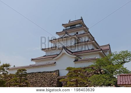 AIZUWAKAMATSU JAPAN - MAY 30 2017: Reconstructed Main Keep of Aizu-Wakamatsu Castle (Tsuruga-jo) Japan. Castle was founded in 1384 by Ashina Naomori demolished in 1874 and reconstructed in 1965