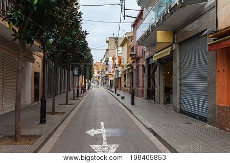 Street In Calella In Catalonia, Spain Near Barcelona. Scenic Old Town With Sand Beach And Clear Blue