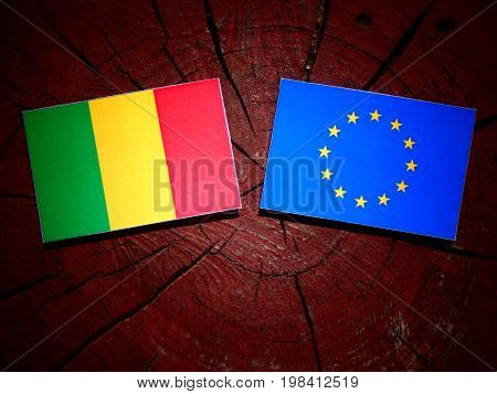 Malian Flag With Eu Flag On A Tree Stump Isolated
