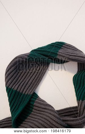 Close-up of wooly scarf on white background