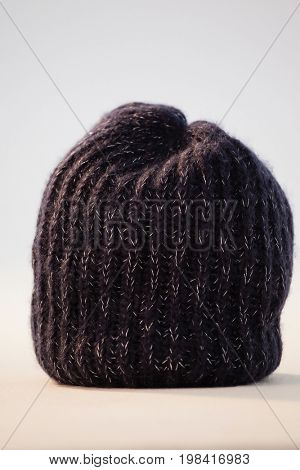 Close-up of wooly hat against white background