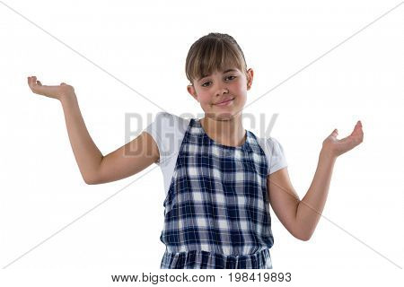 Portrait of cute girl gesturing againt white bcakground