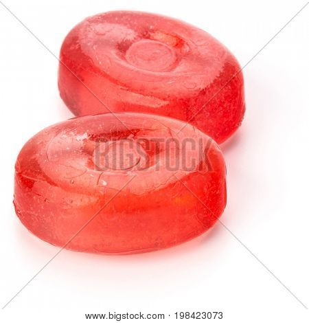Two colorful fruit hard sugar candies,  boiled sweeties or sugar plums isolated on white background cutout