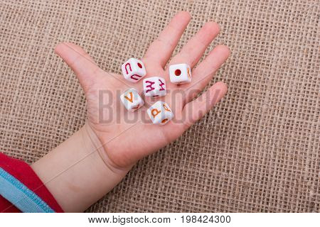 Colorful Alphabet Letter Cubes In Hand