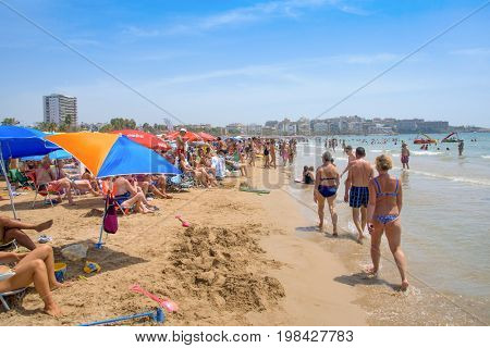 SALOU, SPAIN - AUGUST 3, 2017: Vacationers in the Llevant Beach in Salou, Spain. Salou is a major destination for sun and beach for European tourism, with more than 50,000 accommodations