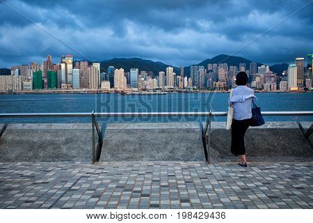 HONG KONG â JULY 18, 2017: Victoria Harbor view with Hong Kong skyline and urban skyscrapers
